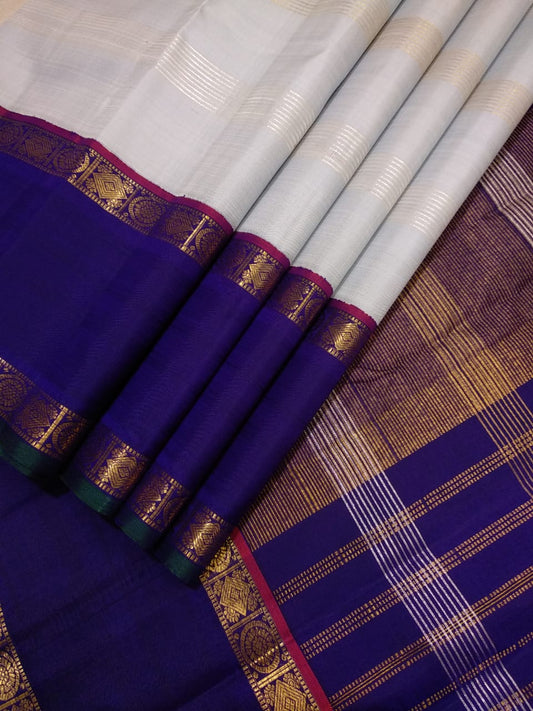 Traditional Korvai Borders with Silver zari & Golden zari stripes on Body