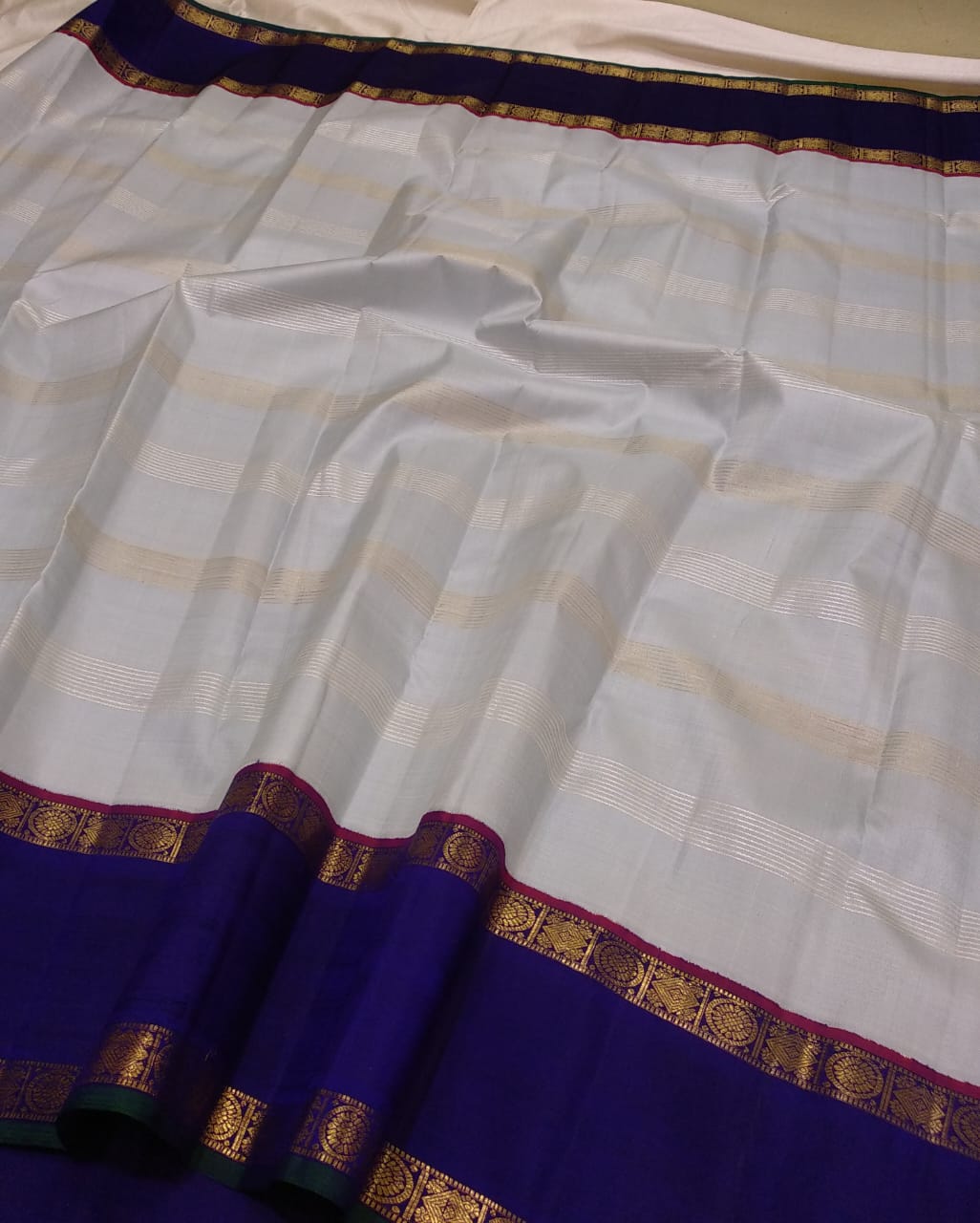 Traditional Korvai Borders with Silver zari & Golden zari stripes on Body