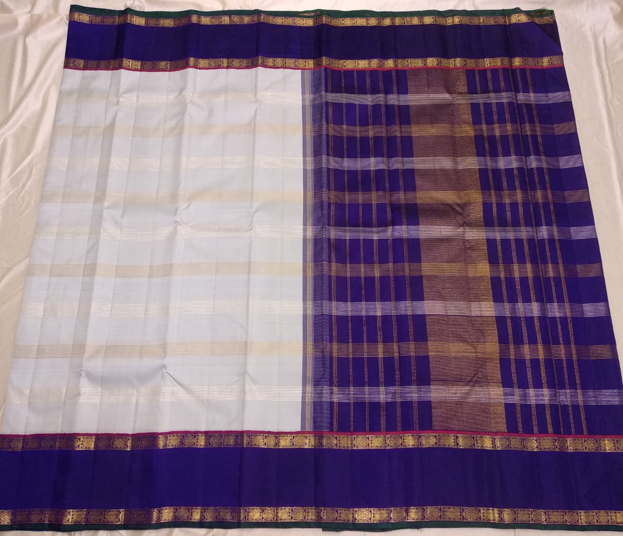 Traditional Korvai Borders with Silver zari & Golden zari stripes on Body